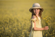 © Alexandr - portrait of a beautiful teenage girl in a hat in a yellow field