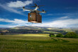 © Rana Dias/Caia Image - Drone delivery crate over rural landscape