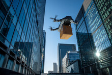 Drone Delivering Package Between Highrise Buildings, London, UK