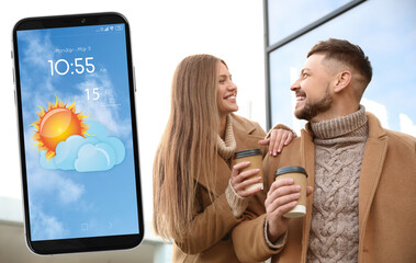 Wall Mural - lovely couple on city street and smartphone with open weather forecast app