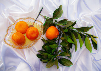 Mandarin orange confiture and green leaves