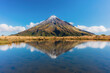 © AWL Images - View of the Taranaki volcano in New Zealand northern island reflecting in a mountain pond on a sunny day