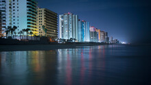 Illuminated Buildings By Beach In City At Night, Daytona, Florida, USA