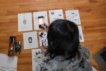 Young Female Transgender Artist Photographing Art With Smart Phone