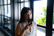 © WavebreakMediaMicro - Asian woman talking to her phone