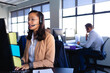 © WavebreakMediaMicro - African American woman working with headset phone in office