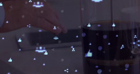 Wall Mural - digital composite video of web of connections with icons moving against person using a digital table