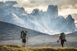 © Cavan Images - Two climbers hike toward Mount Asgard in Akshayak Pass, Baffin Island.