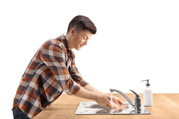 Wall Mural - Profile shot of a guy washing hands