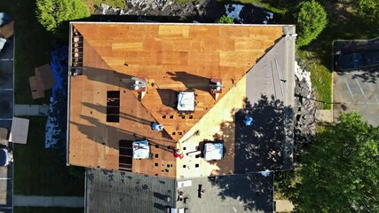 Wall Mural - East Brunswick NJ US. 20 JUNE 2020: Removal of old roof and replacement with new roof shingle being applied home roof construction site all a new materials