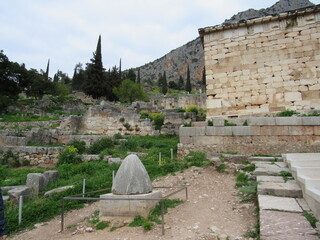 The Navel of the World, also called the Omphalos Stone, located in the ancient ruins at the Temple of Apollo in Delphi, Greece