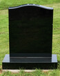 Tombstone in polished black granite with blank inscription area for copy space
