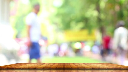 Wall Mural - Brown wooden counter for a place to advertise background bokeh blurred in the park.