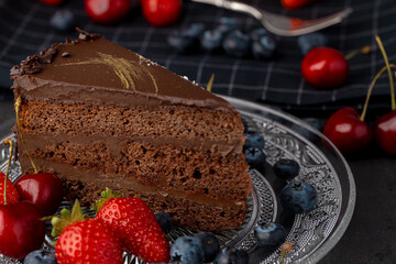 Piece of chocolate cake served with fresh berries