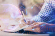 © peshkova - Multi exposure of two men planing investment with stock market forex chart.