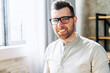 © Vadim Pastuh - Close-up portrait of young attractive man in glasses, he is smiling at the camera, office worker