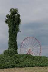 Sticker - Vertical shot of a Ferris wheel and a tree