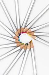 Poster - Vertical closeup shot of colorful pencils with silver covers in an artistic shape