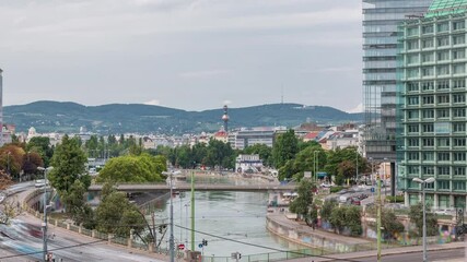 Wall Mural - The Schwedenplatz aerial timelapse (Sweden Square) is a square in central Vienna, located at the Danube Canal and one of the most important public transport junction. Old and modern buildings around