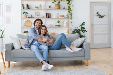 Wall Mural - Photo of relaxed man and woman spending weekend at home