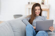 © Prostock-studio - Happy girl chatting with friends online, using laptop