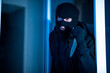© Prostock-studio - Criminal breaking in an apartment or office holding knife