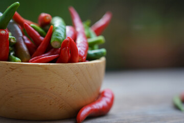 Selective focus fresh chili hot and spicy raw Asian food in  wooden bowl