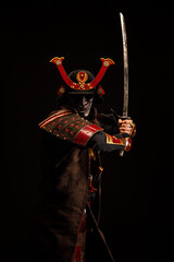 Portrait of a samurai in armor in attack position