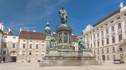 Sticker - Statue of Kaiser Franz Joseph I timelapse hyperlapse at the Hofburg Palace in Vienna. It is located in the courtyard of Hofburg Palace. Blue sky at sunny day