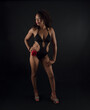 © Magdalena Juillard - Sensual and attractive African American woman wearing a one piece swimsuit