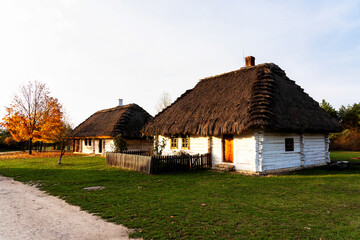 Wall Mural - Old traditional polish wooden house in an open-air museum of Kielce (Muzeum Wsi Kieleckiej), Tokarnia, Poland, Europe. Picture taken during famous polish golden autumn.