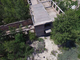 Fototapeta Paryż - Drone quadrocopter explores an abandoned industrial building.Kiev