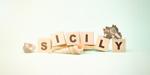 word Sicily made with wooden blocks seashells and starfish