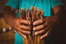 Detail Of Artisan's Hand And Reed Straws For Production Of Traditional Handicraft Mat Made Of Dry Reed In A Local Community Of Garopaba, Brazil. 