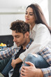 © LIGHTFIELD STUDIOS - Selective focus of beautiful girl embracing handsome boyfriend with closed eyes at home