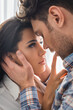 © LIGHTFIELD STUDIOS - Selective focus of beautiful woman touching lips of boyfriend