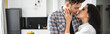 © LIGHTFIELD STUDIOS - Panoramic orientation of attractive girl kissing handsome boyfriend at home
