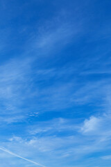 Wall Mural - Blue sky with some white clouds around 