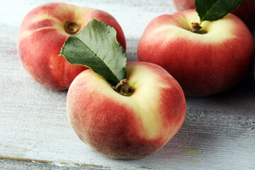 Wall Mural - A group of ripe peaches on wooden table