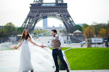 Happy bride and groom enjoying their wedding in Paris