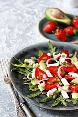 Sticker - salad with strawberries and avocado, arugula, feta cheese, pumpkin seeds, red onion