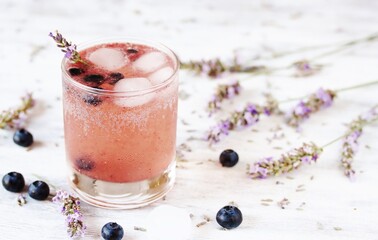 Sticker - blueberries and lavender syrup Cold carbonated lemonade (soda) with . Soft focus. Place for text. Copy Sp