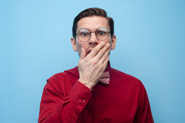 Wall Mural - Portrait of shocked surprised young man in glasses