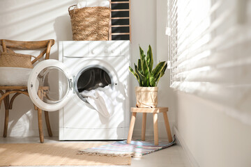 Canvas Print - Modern washing machine in laundry room interior