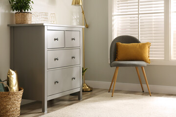 Poster - Grey chest of drawers in stylish room interior