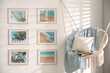 © New Africa - Different pictures on wall and hanging chair in room. Artworks in interior design