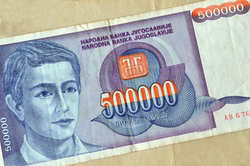 Obverse of 500.000 dinars paper bill issued by Yugoslavia, that shows portrait of young man