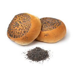 Fresh baked buns with poppy seed and a heap of poppy seed