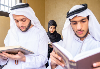 Wall Mural - Happy msulim family reading Quran togther