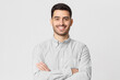 © Damir Khabirov - Smiling businessman in gray shirt isolated on studio background
